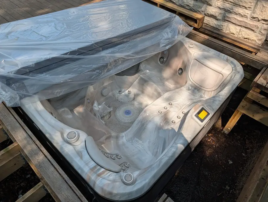 New wrapped hot tub set into a deck cut-out in Markham